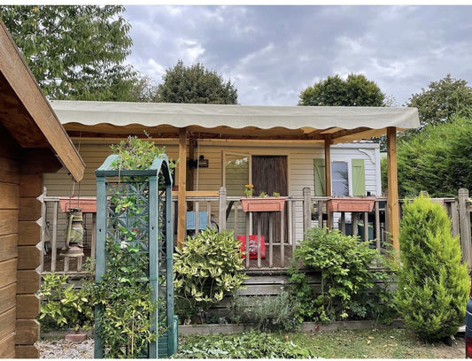 mobile home with veranda in a garden setting