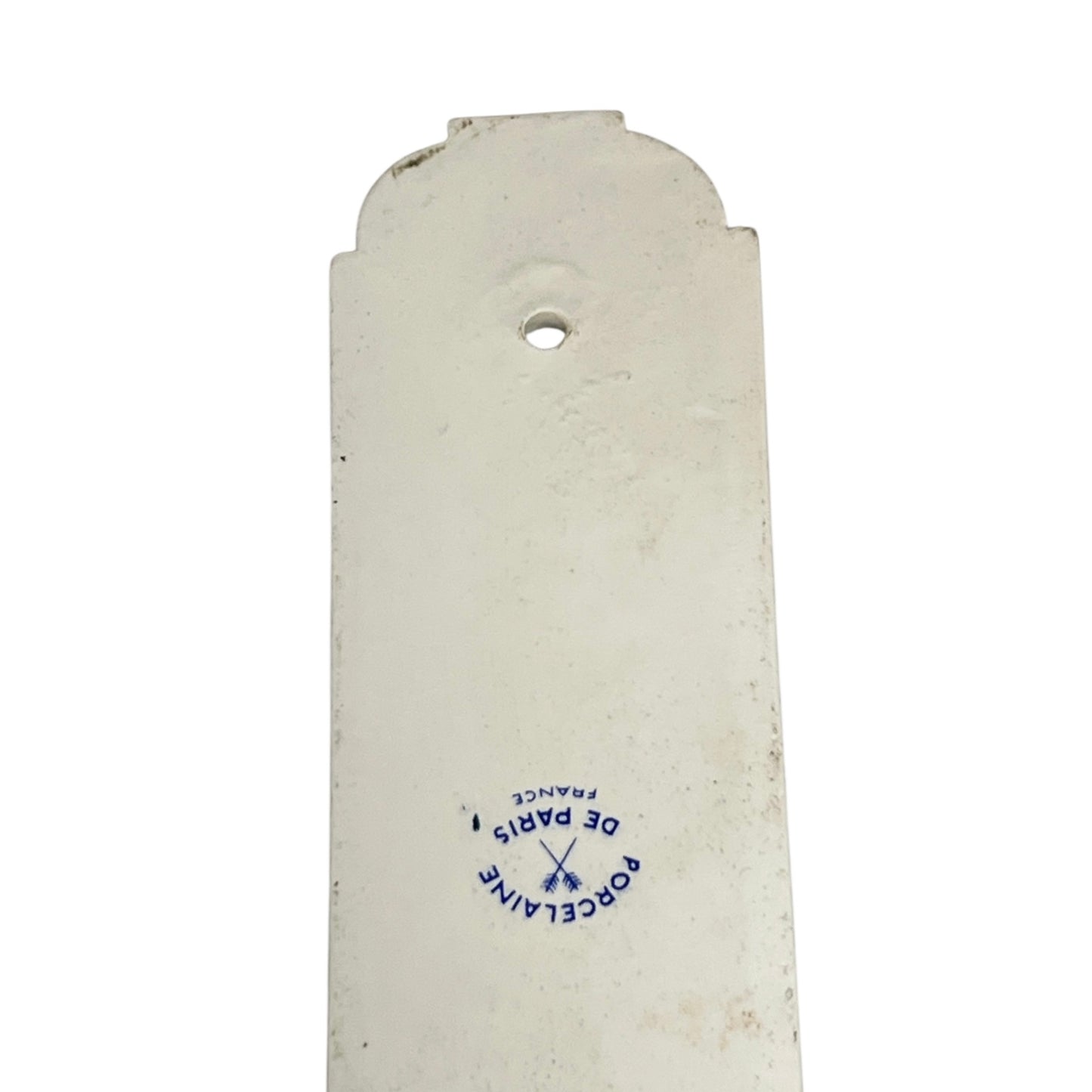 Close up of the back of a finger push plates on a white background