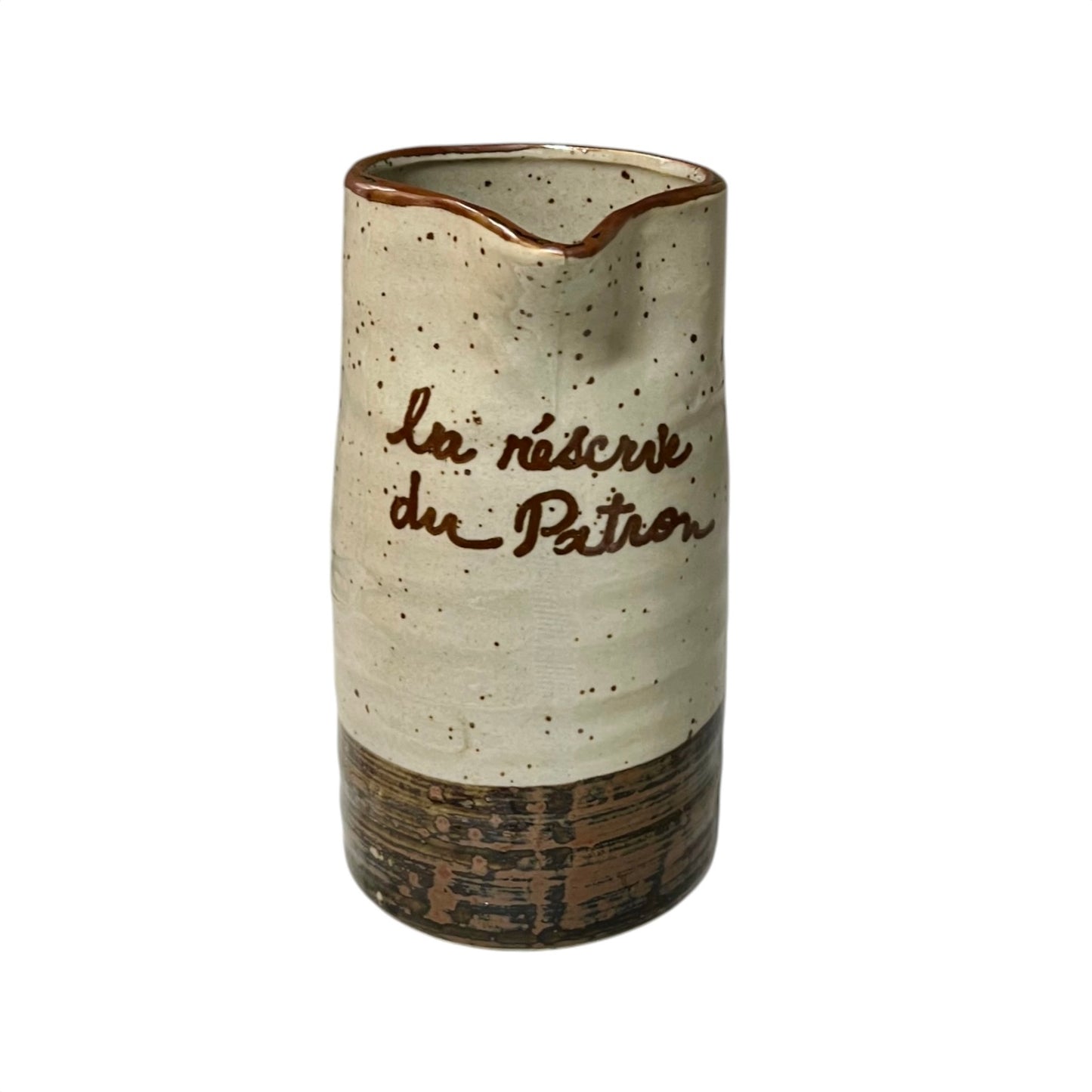 Ceramic speckled brown and cream vase with French text on a white background