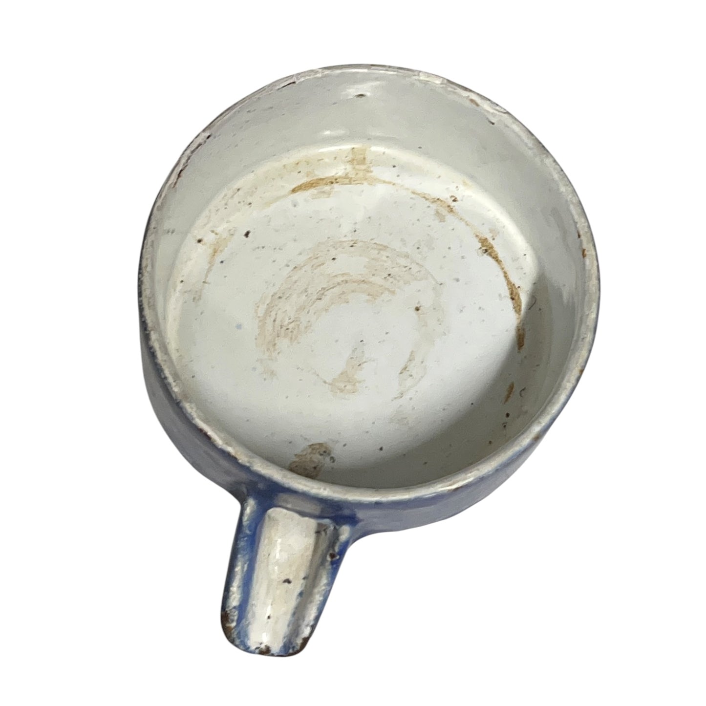 Close-up of a vintage fruit press with a blue pot on a white background