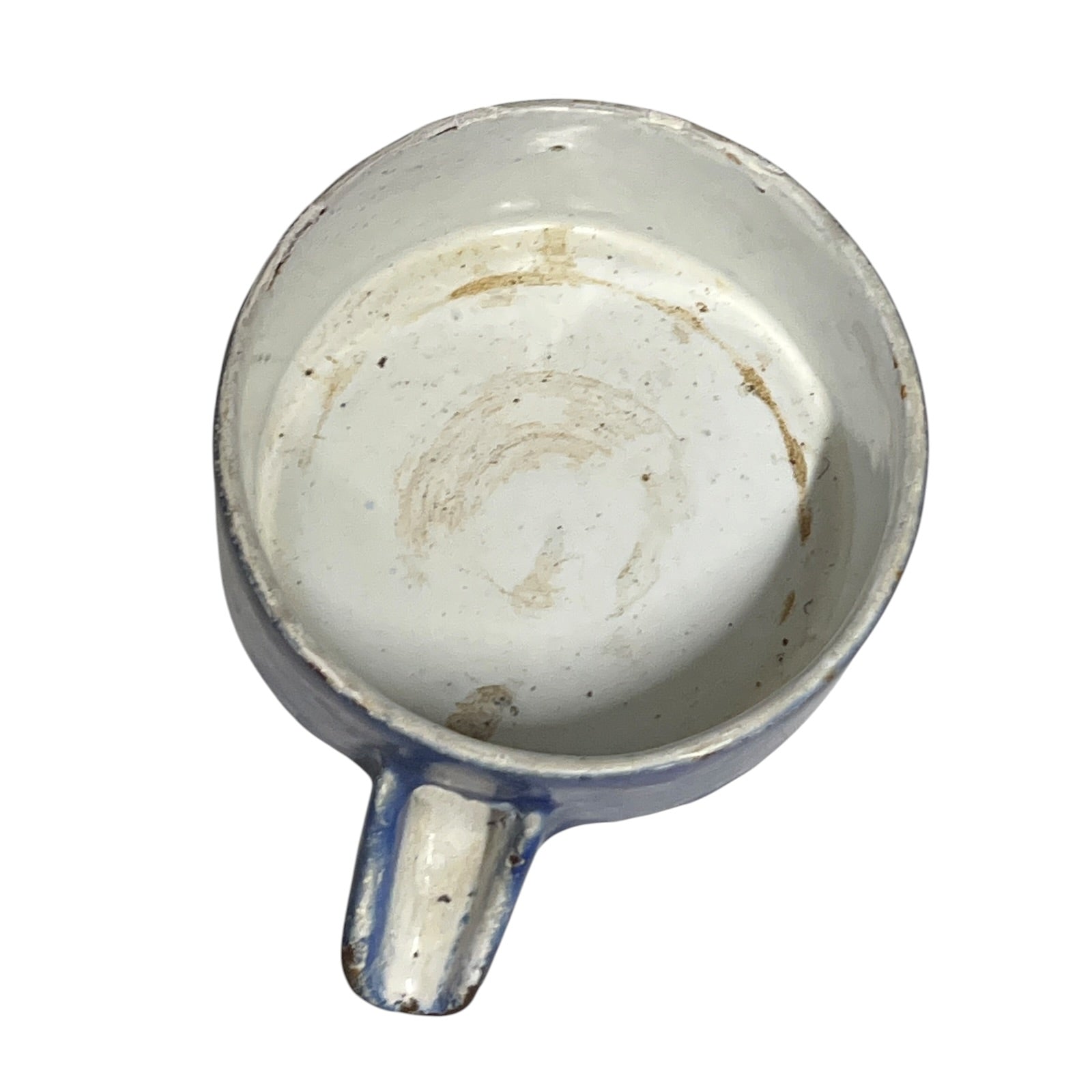 Close-up of a vintage fruit press with a blue pot on a white background