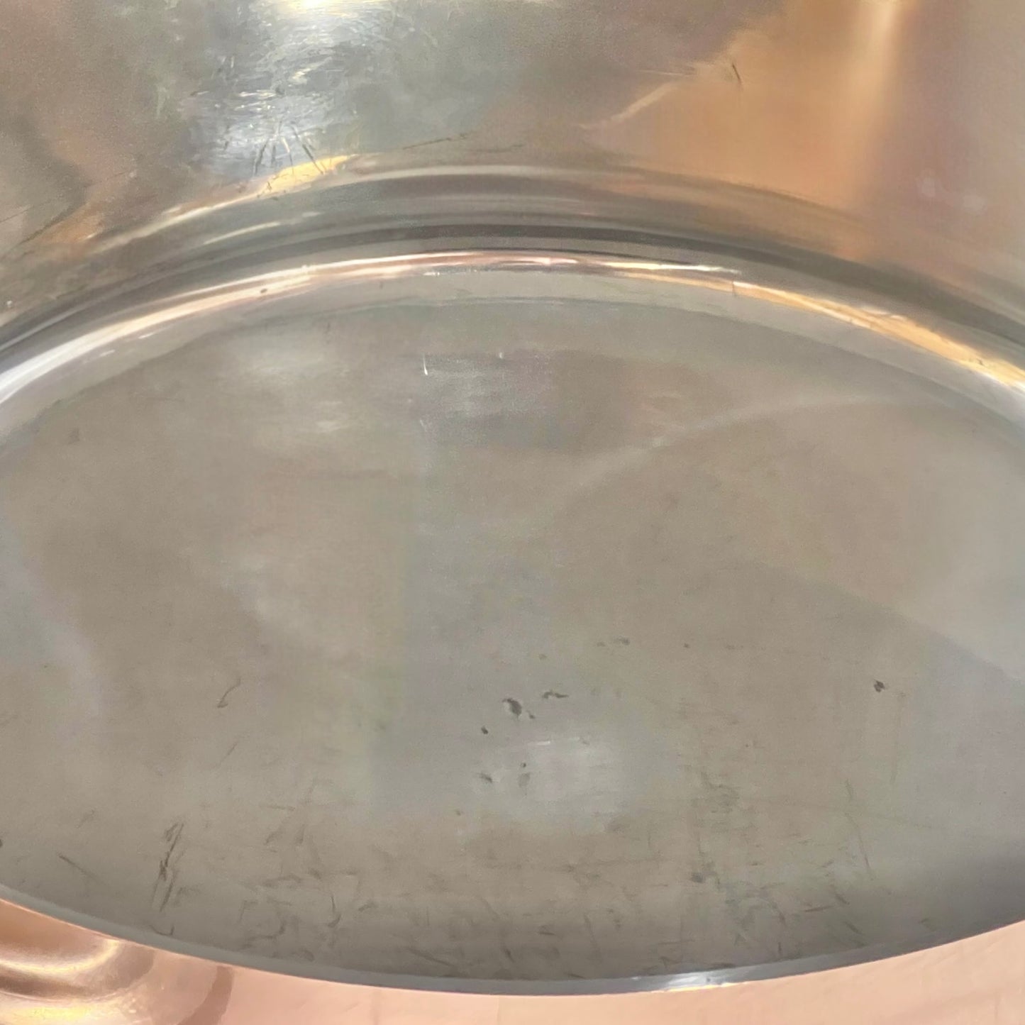 Close-up of the inner of a  copper pot handle on a white background