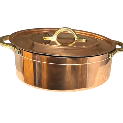 Copper pot with lid on a white background