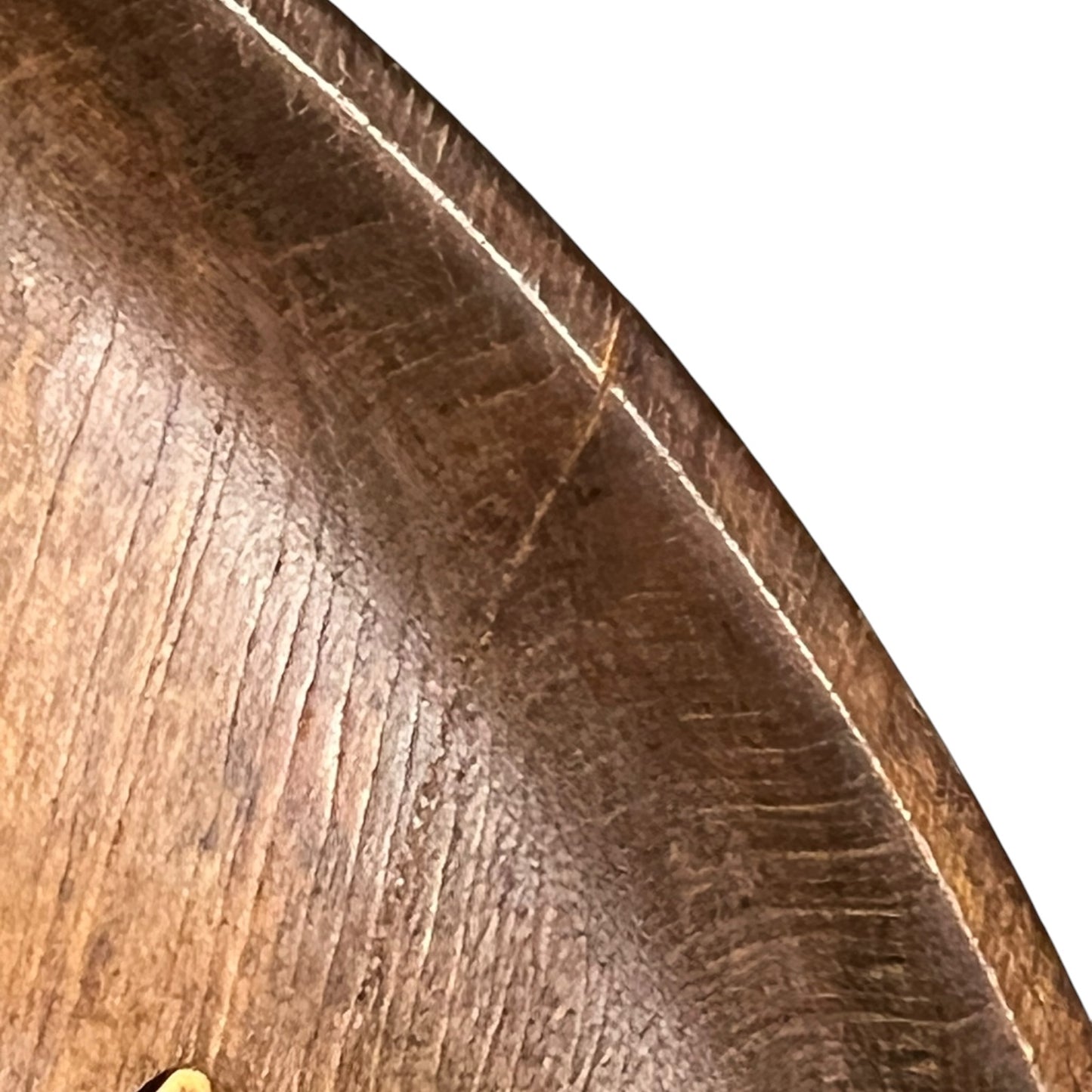close up of a wooden decorative round plaque on a white background 