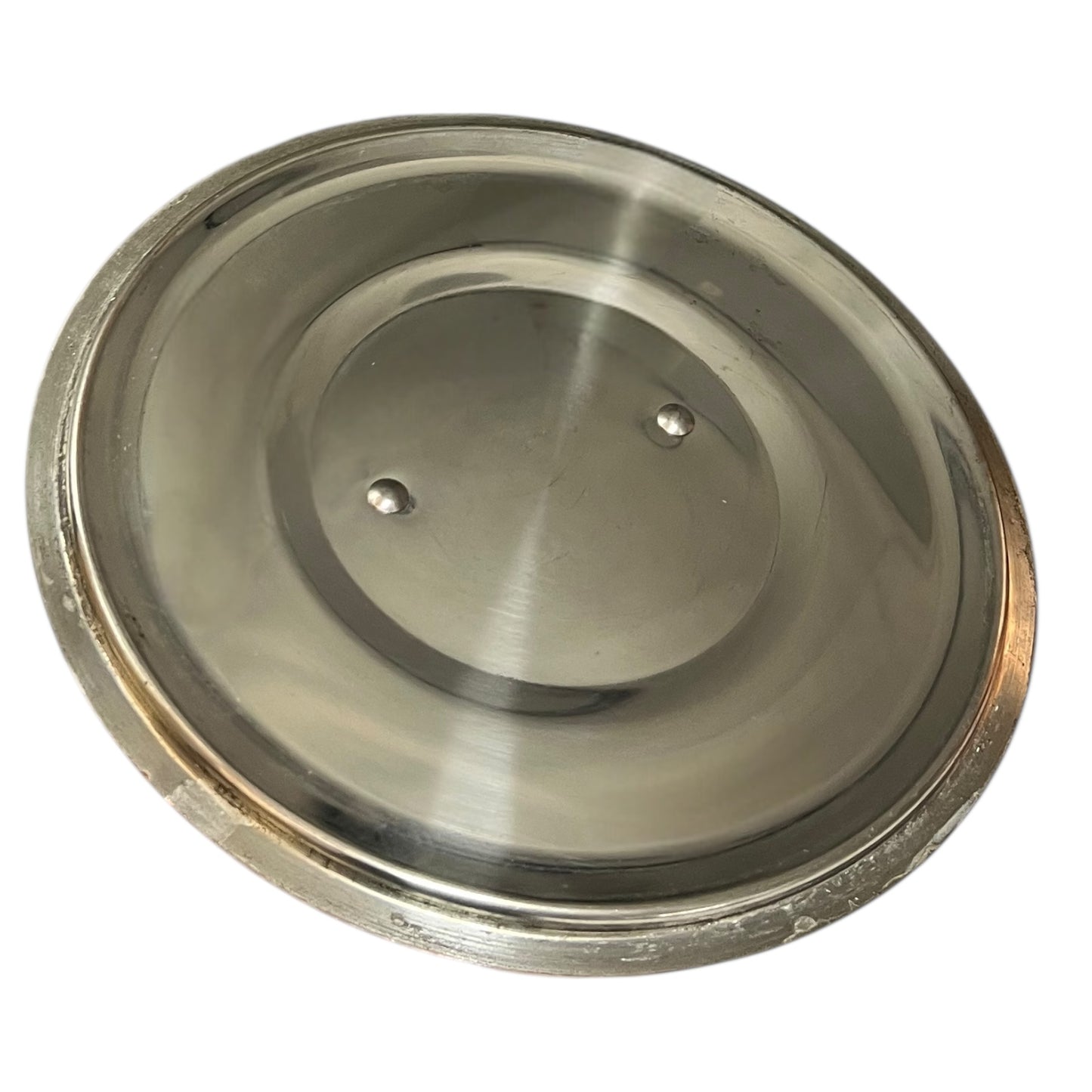 Inside of pan lid on a white background