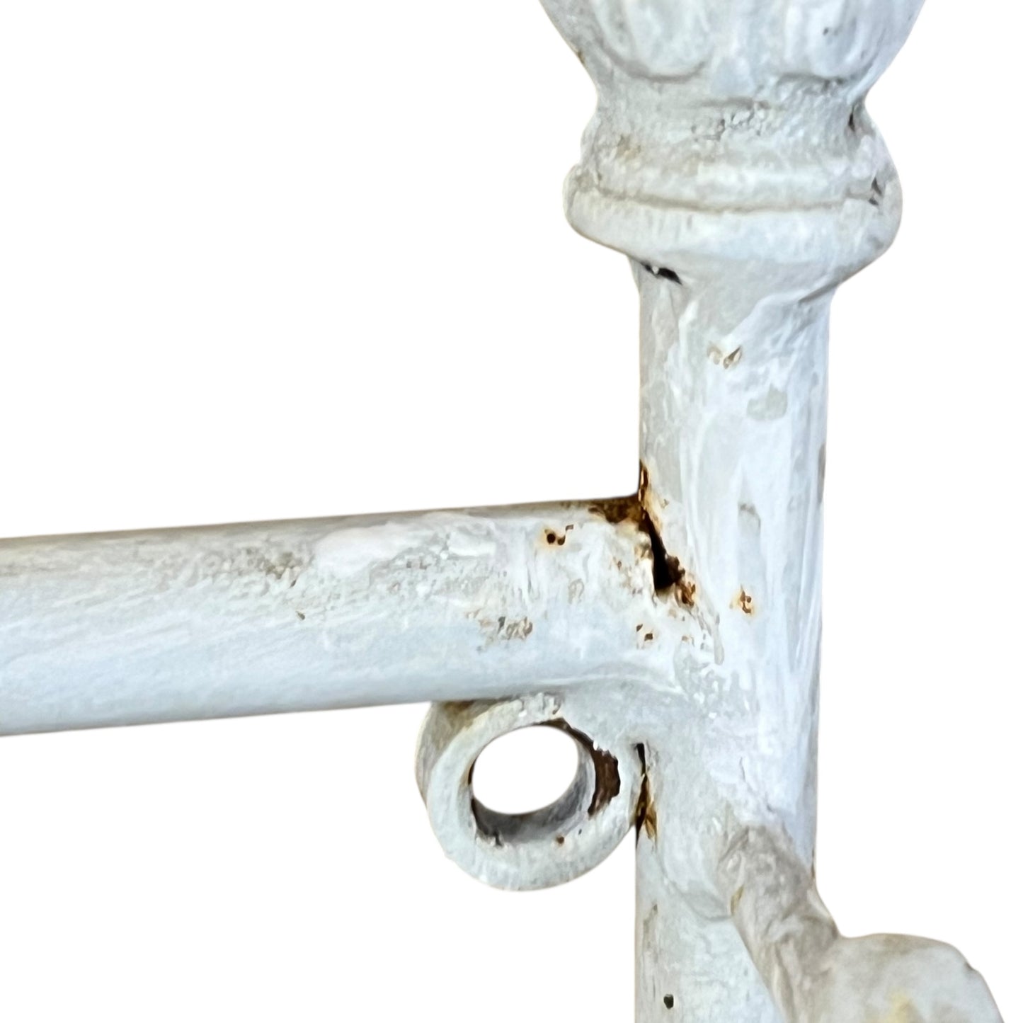 Close-up of a metal she with visible wear and tear on a white background