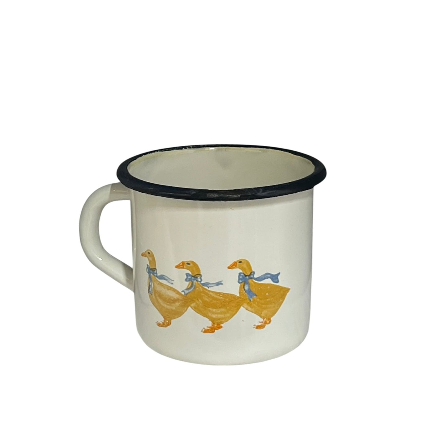 Close up of a white enamel milk churn and mug with duck design on a white background