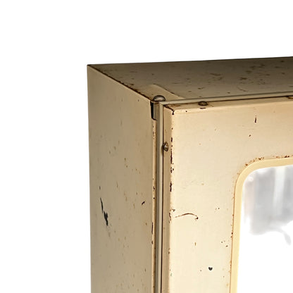 close up of a vintage metal bathroom cabinet