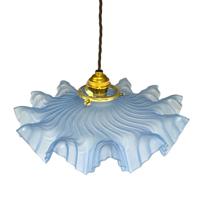 Vintage-style pendant light with a blue glass shade, a brass fitting and a brown twisted wire on a white background for sale from All Things French Store