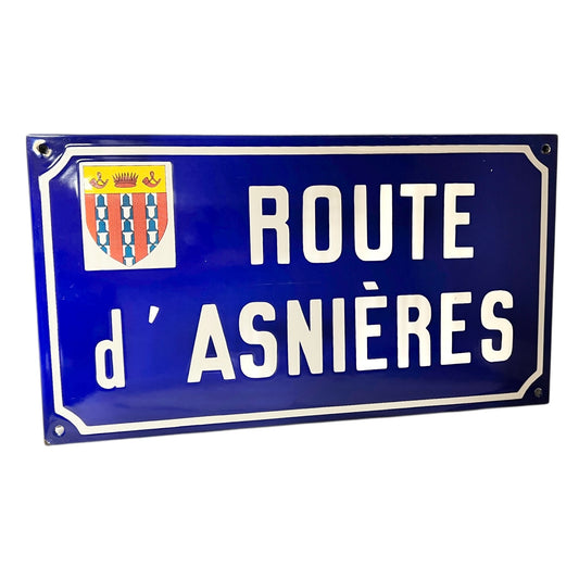 Blue street sign with white text 'ROUTE d' ASNIèRES' on a white background