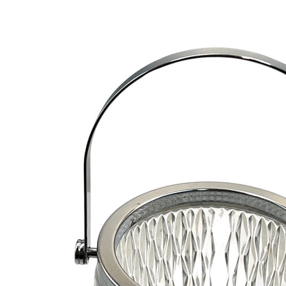 Close up of a French vintage glass ice bucket with a silver coloured collar and a handle on a white background 