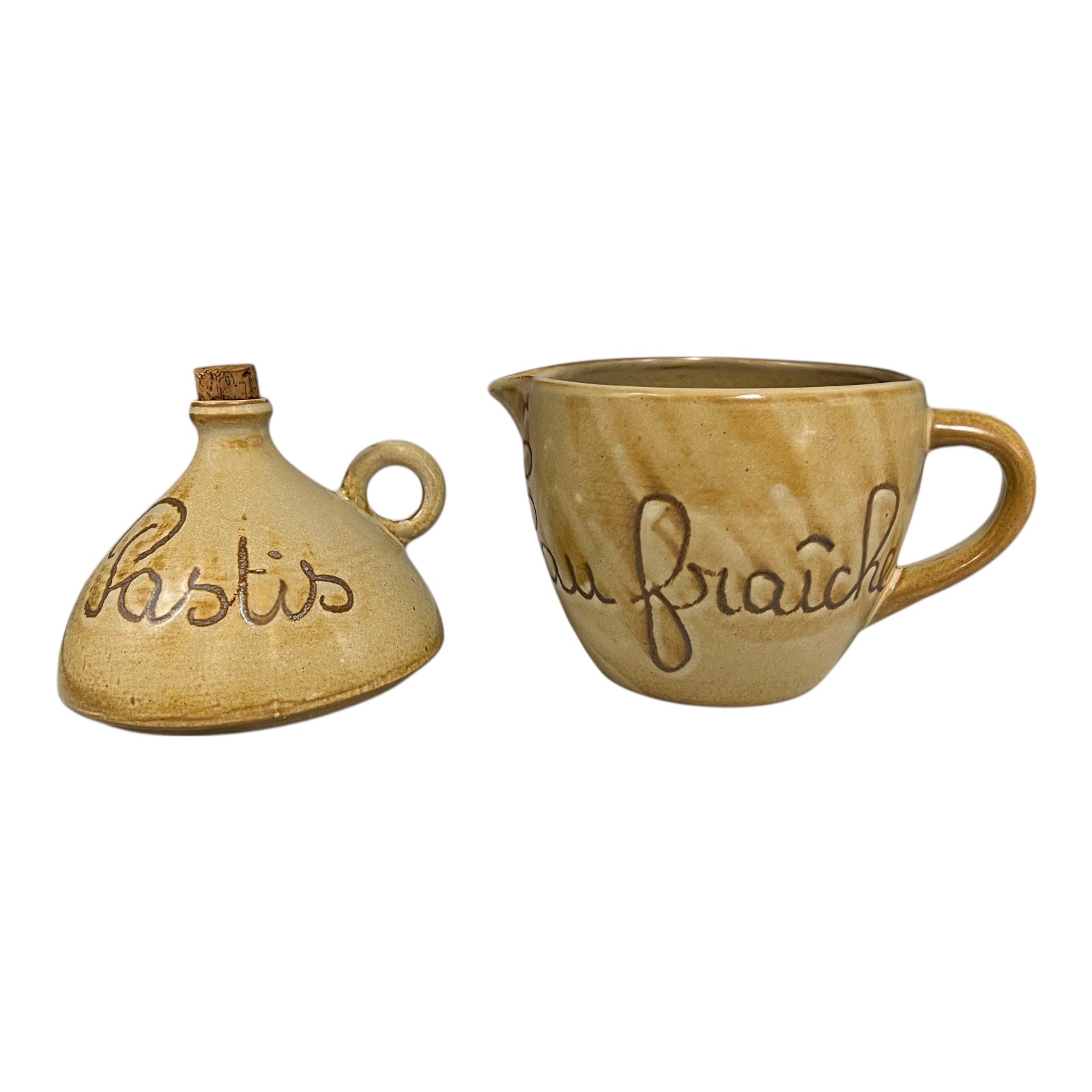 Two ceramic containers with embossed text on a white background