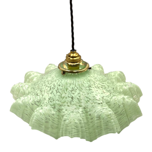 Vintage-style pendant light with textured green glass shade on a white background