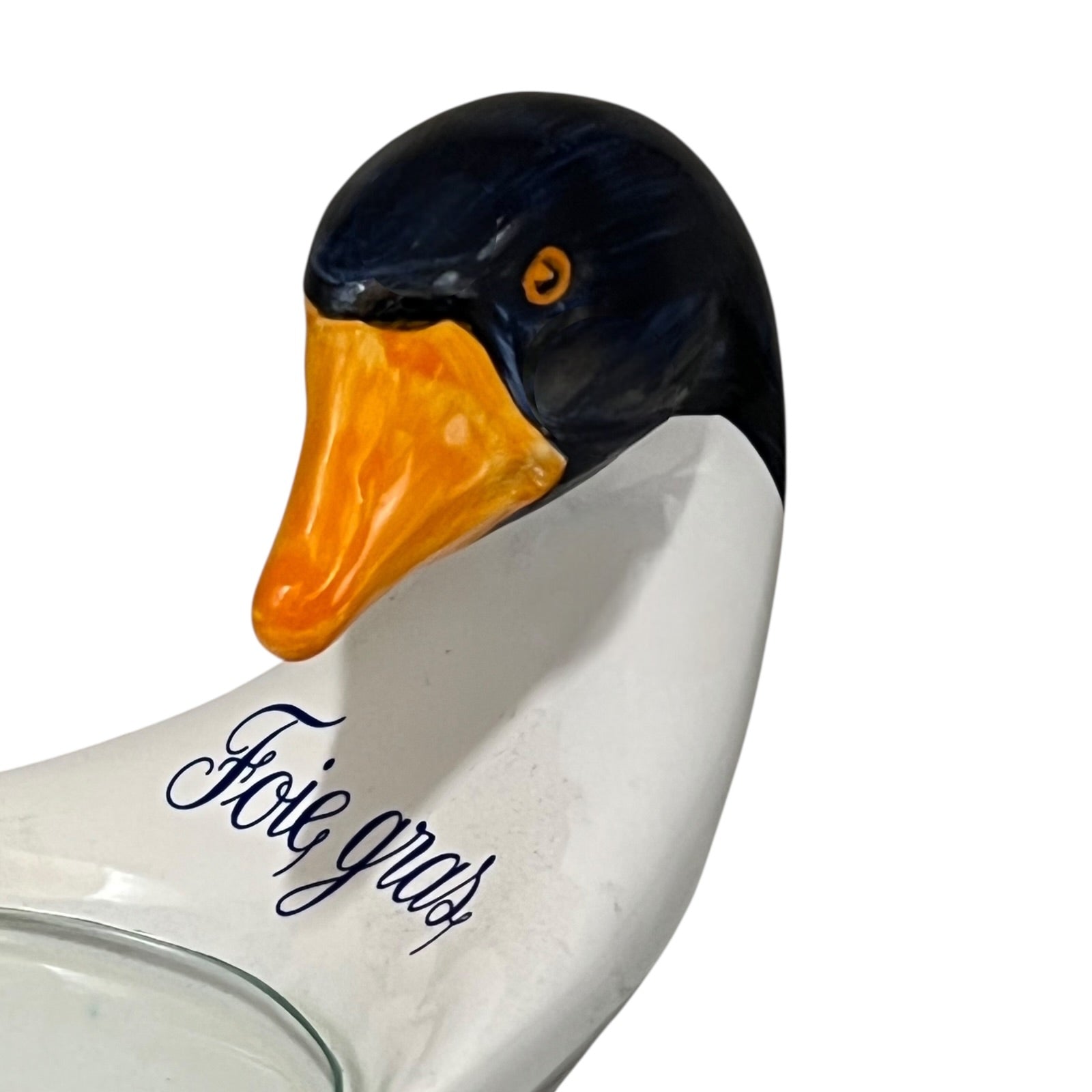 Ceramic dish shaped like a duck with Foie Gras' text on a white background