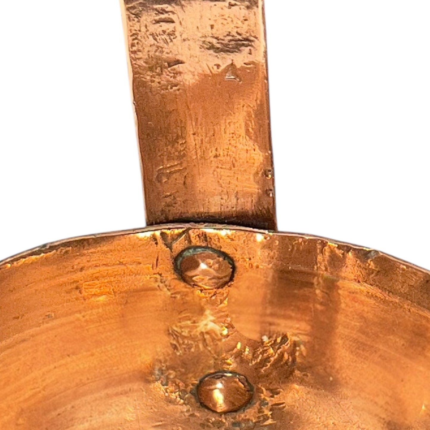 Close up of a French copper handmade ladle on a white background
