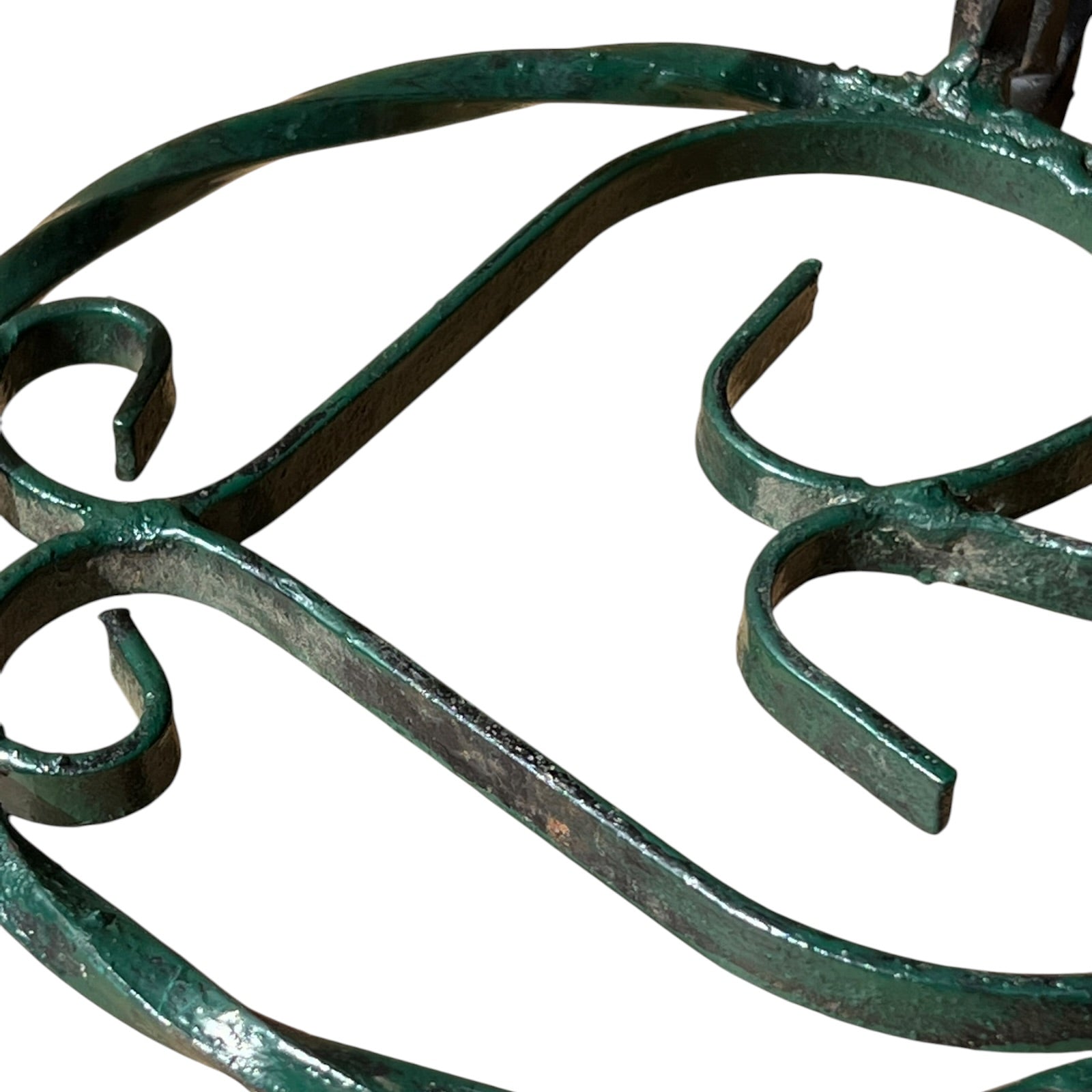 Close up of a wrought iron vintage plant stand on a white background 