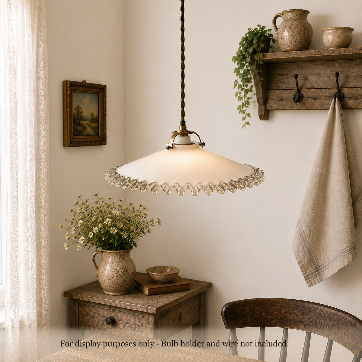 Vintage-style pendant light hanging in a room with wooden furniture and decor.