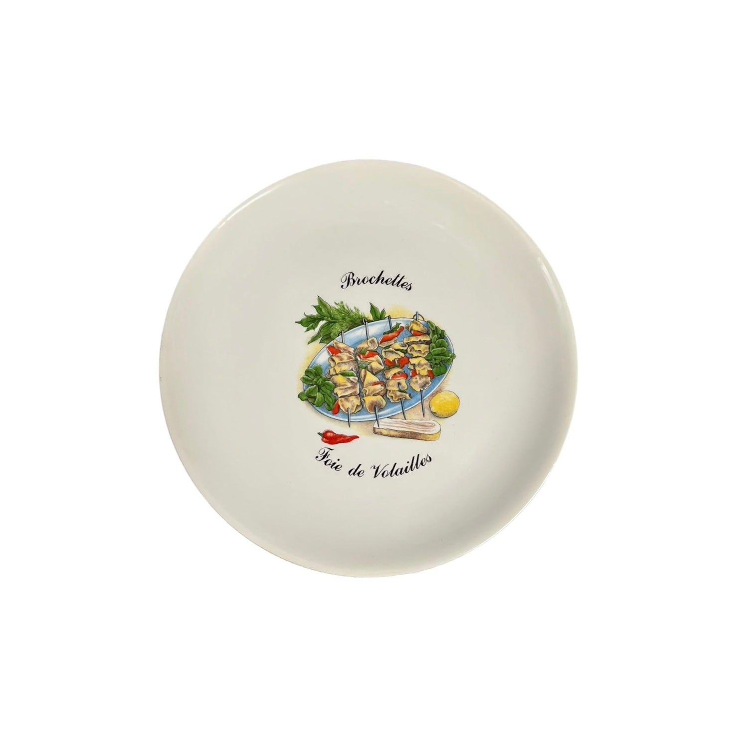 Round ceramic plate with a decorative design of skewered vegetables and text on a white background