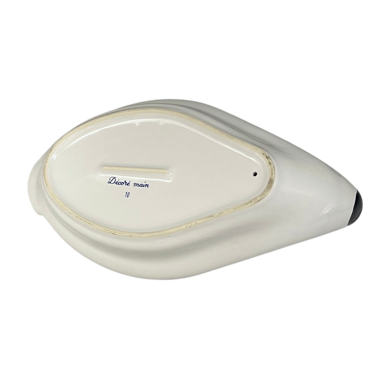 White ceramic dish with decorative text on a white background