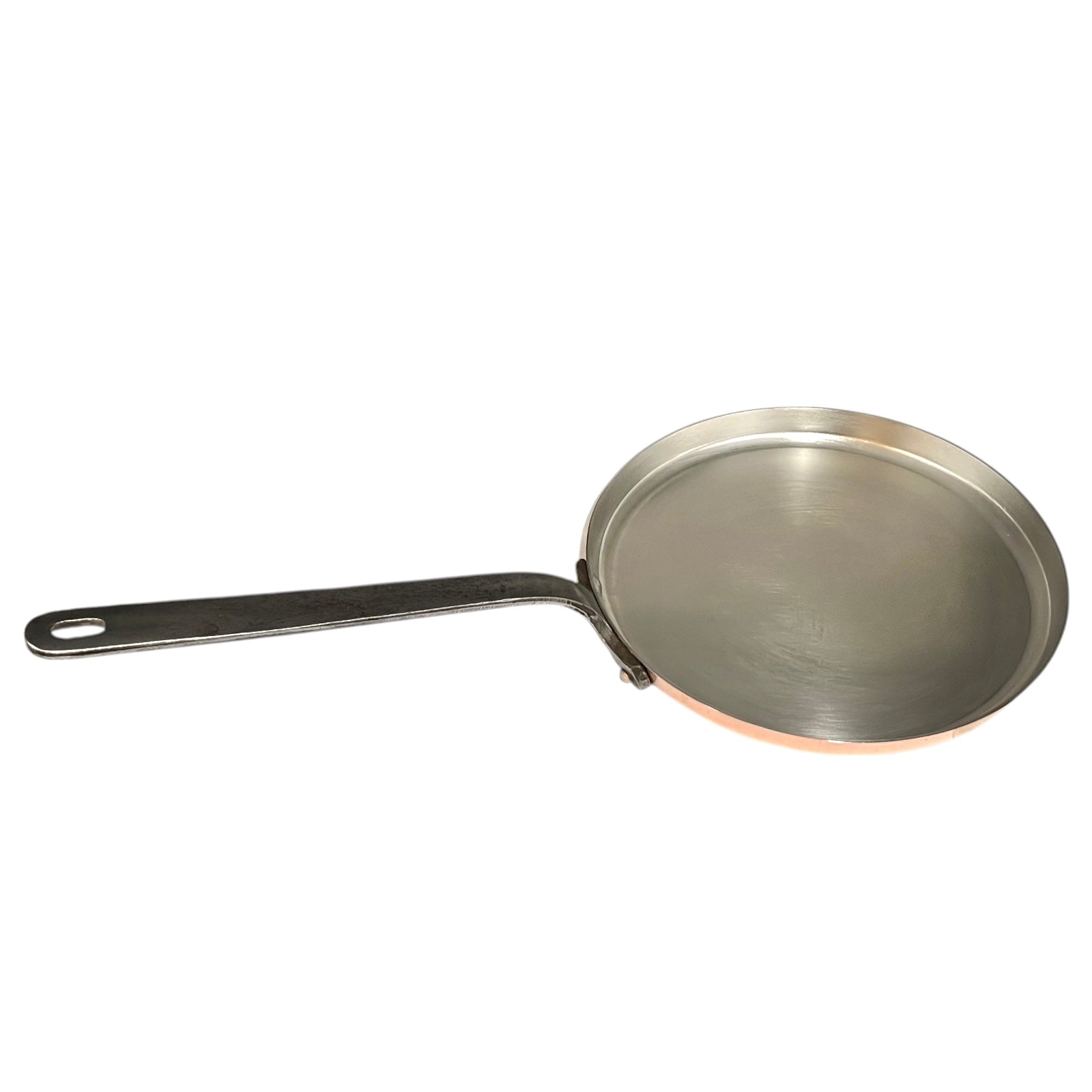 Metal frying pan with a handle on a white background