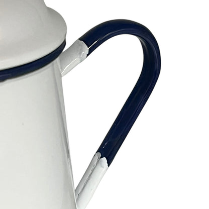 Close up of an enamel coffee pot on a white background