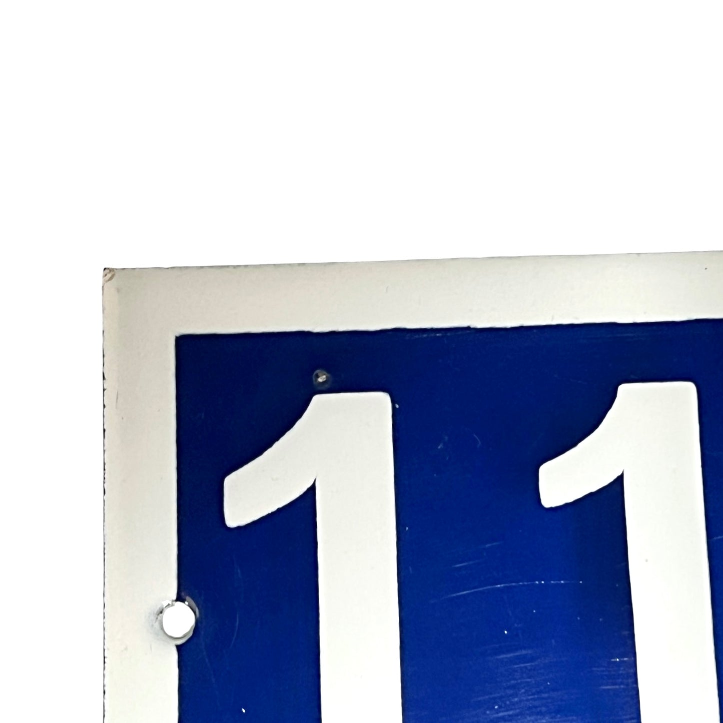 Close up of a French door number on a white background