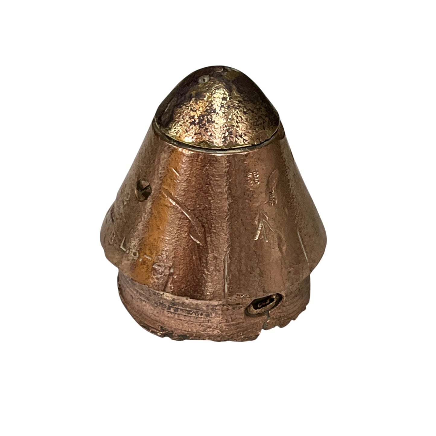 A small metallic bronze-colored object with a conical top and textured, worn surface, photographed against a plain white background.