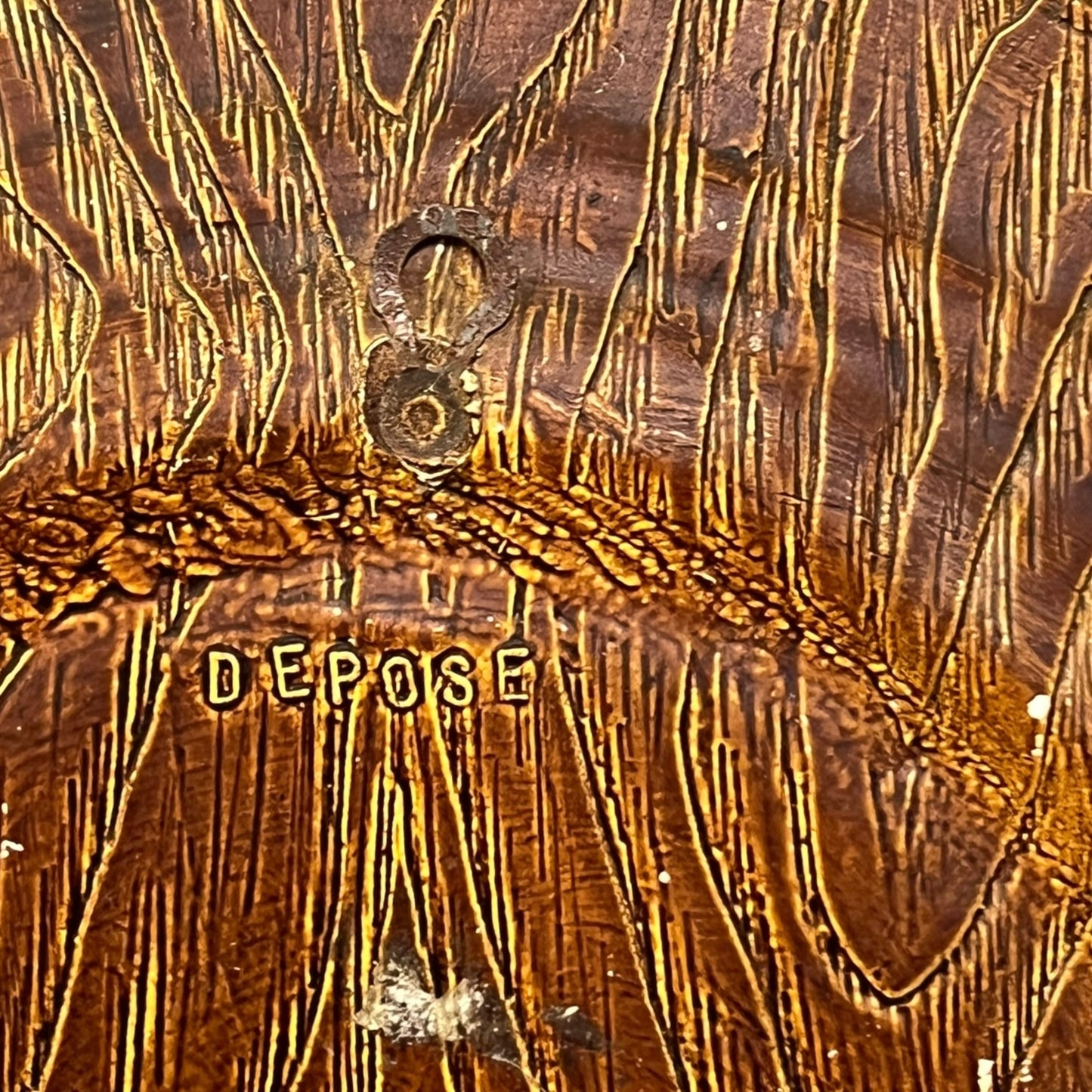 Close up of a raised 3d wood resin wall plaque of a French baker on a white background