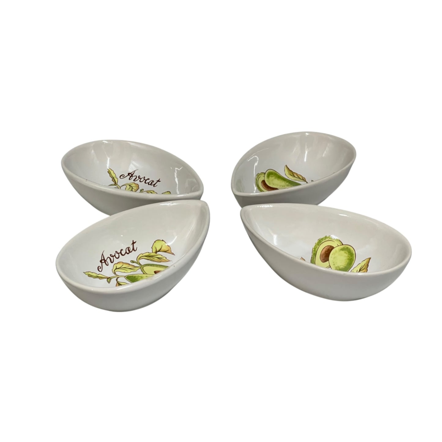 Four white ceramic avocado-themed serving bowls arranged in a square on a white background, each decorated with illustrations of avocado slices and the word 'Avocado'.