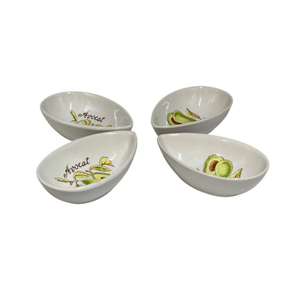 Four white ceramic avocado-themed serving bowls arranged in a square on a white background, each decorated with illustrations of avocado slices and the word 'Avocado'.