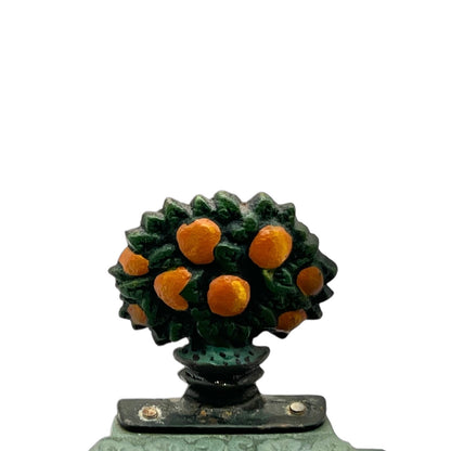 Decorative metal fruit soap dish on a white background