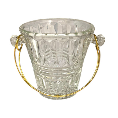 Clear glass ice bucket with gold handles on a white background