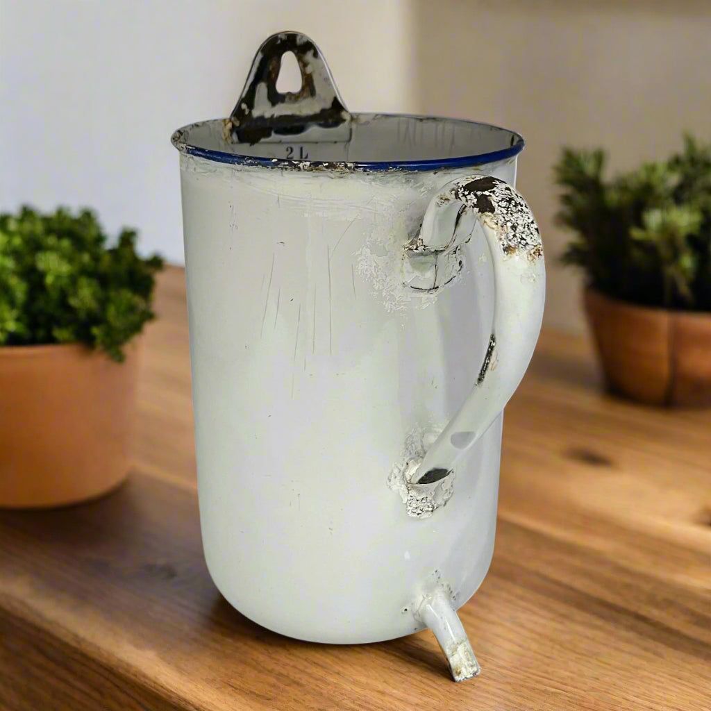 French vintage enamel irrigator in white with a blue trim in a well worn condition for sale from All Things French Store