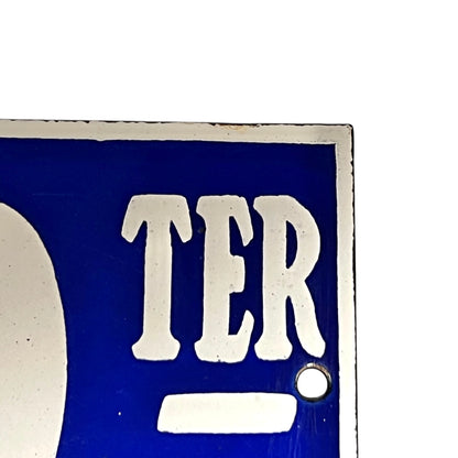 Close-up of a blue and white sign  on a white background