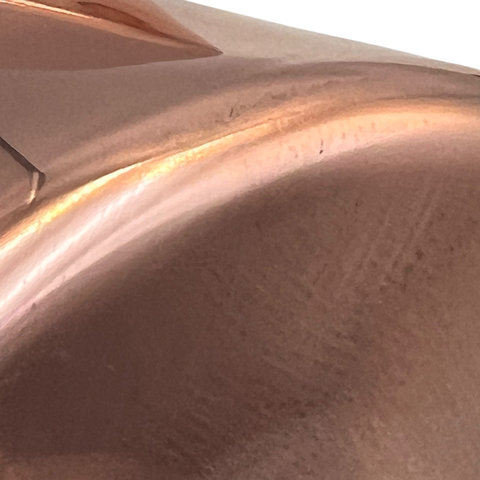 close up view of rim for copper pan 