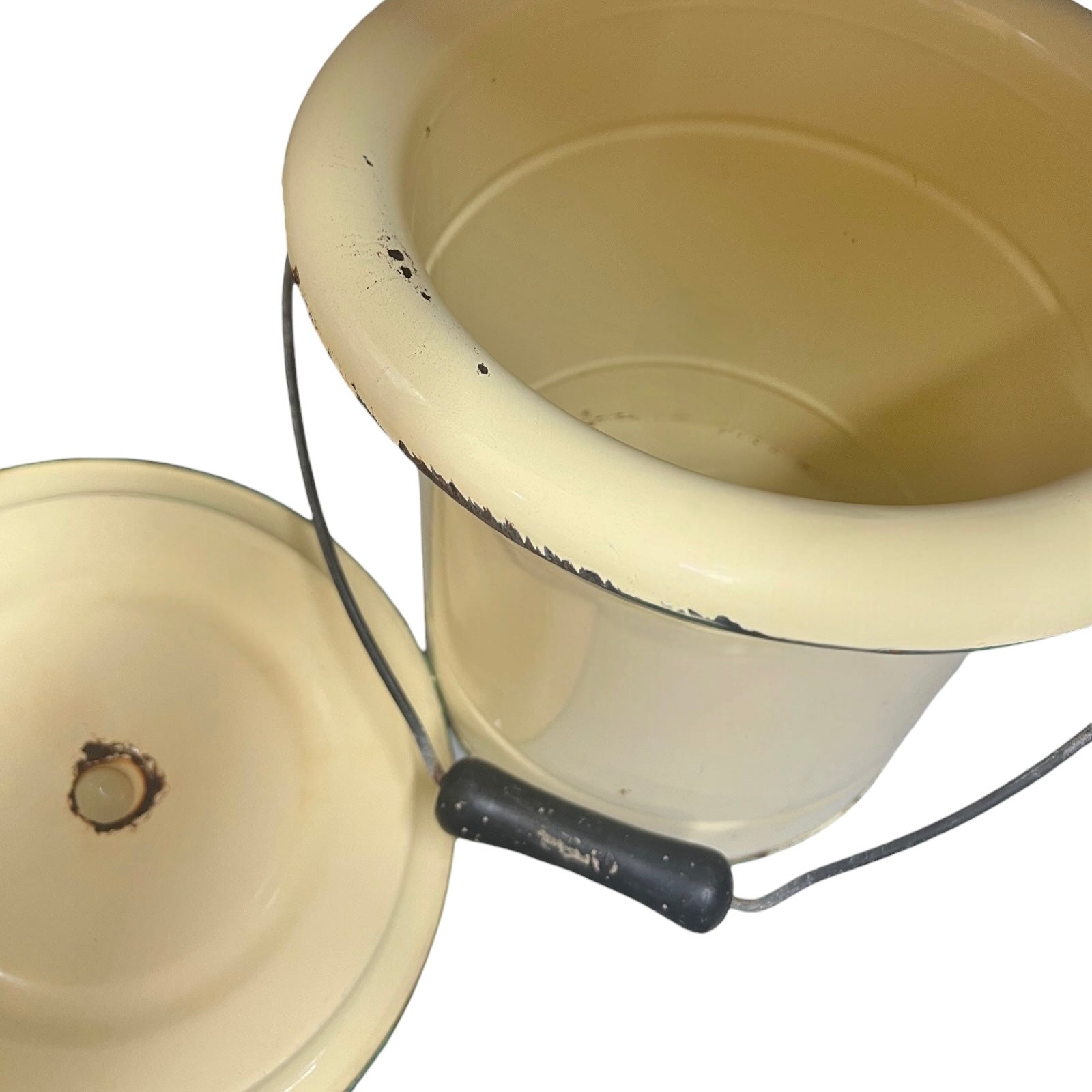 Close up of a French enamel bucket on a white background 