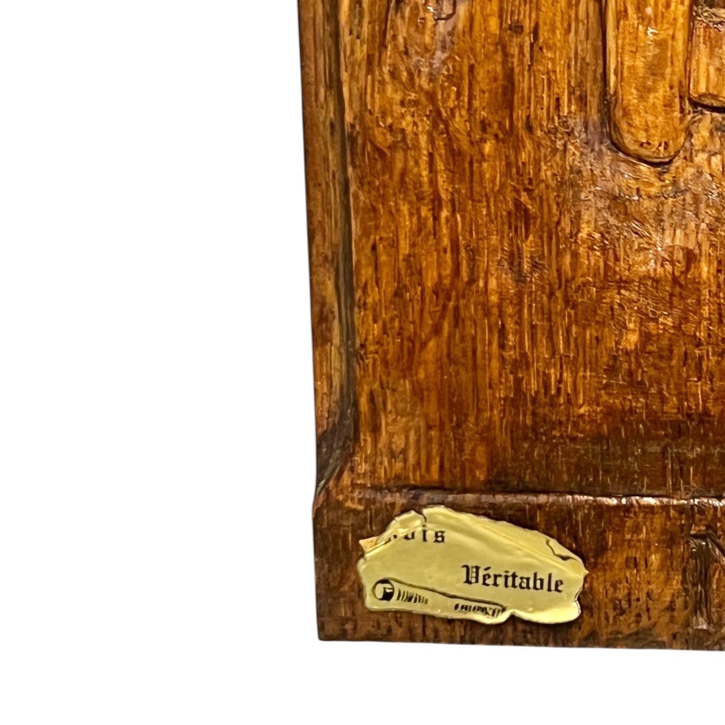 Wooden plaque with a gold label on a white background