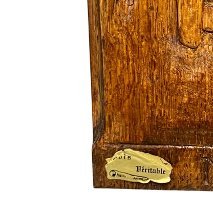 Wooden plaque with a gold label on a white background