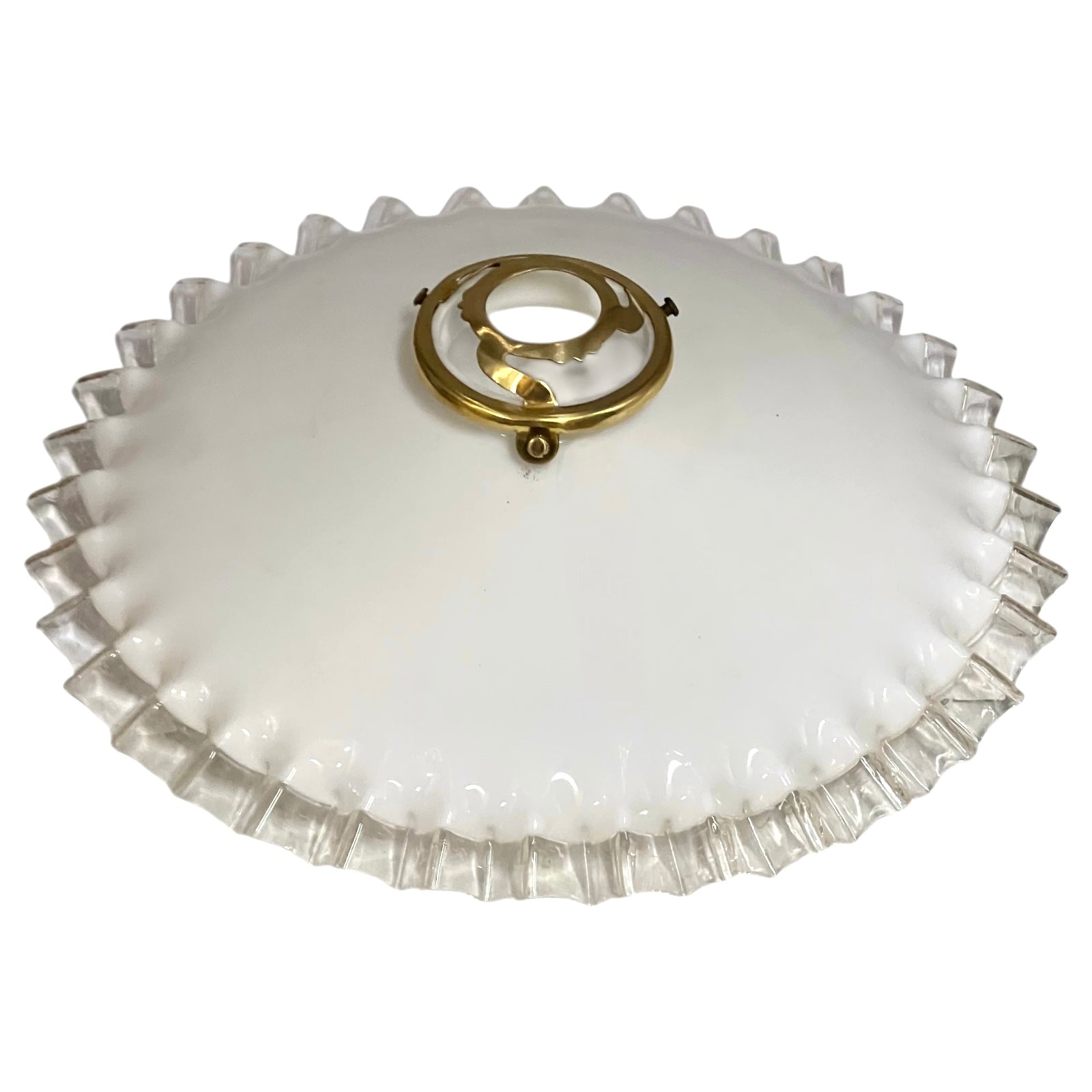 Vintage glass lampshade with ruffled edge and gold fixture on a white background