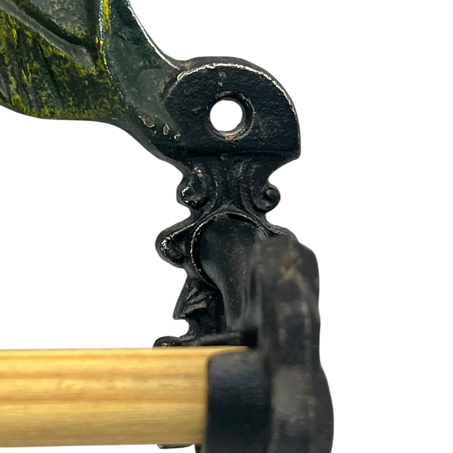 close up of a cast iron kitchen roll holder on a white background 
