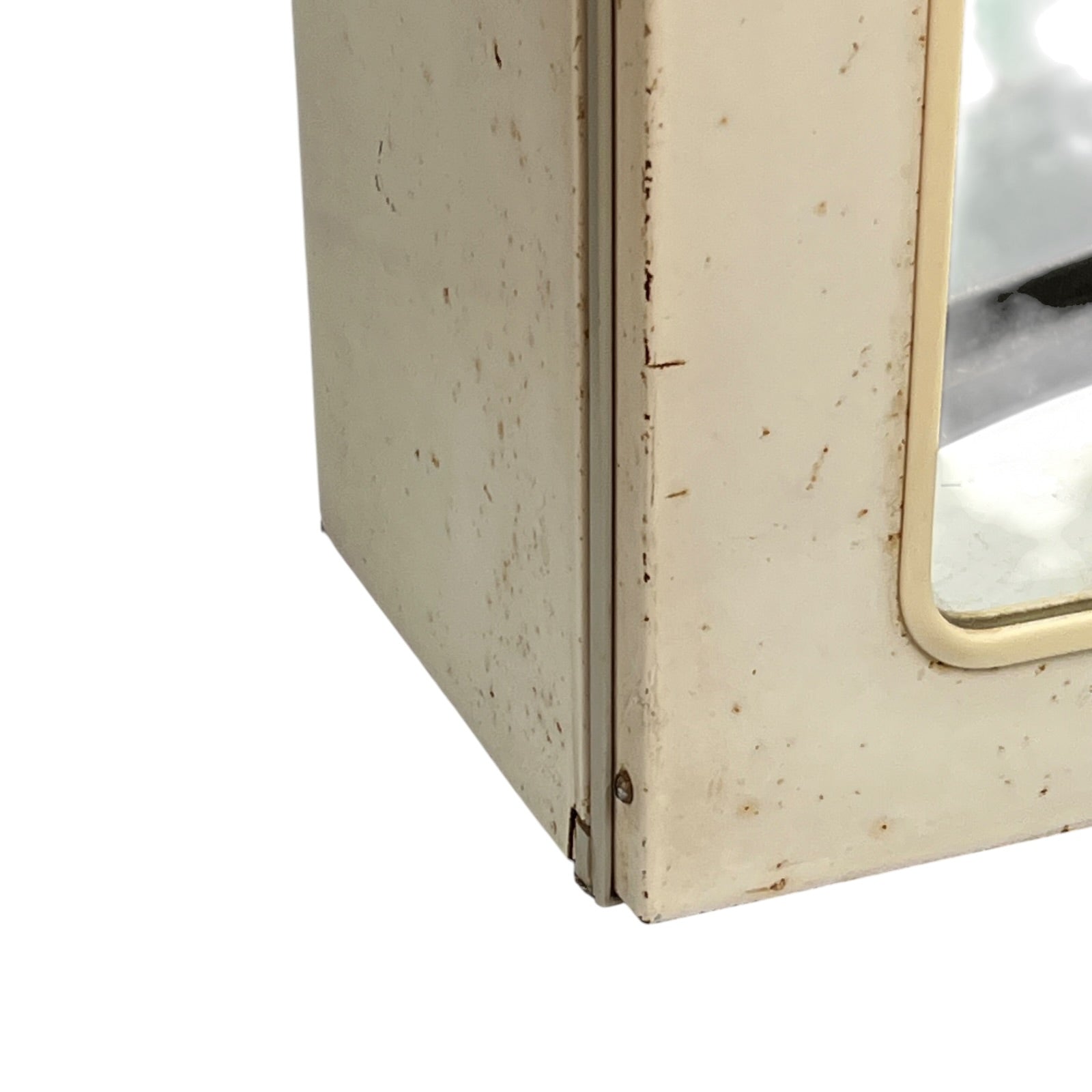 close up of a vintage metal bathroom cabinet