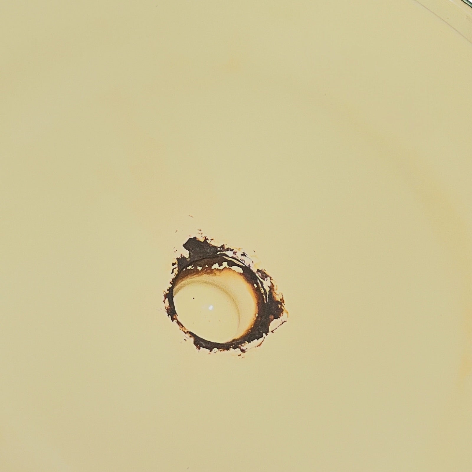 Close up of a French enamel bucket on a white background 