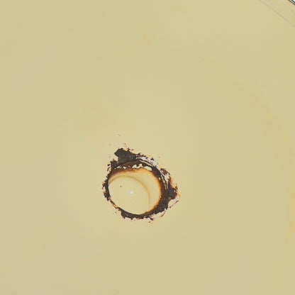 Close up of a French enamel bucket on a white background 