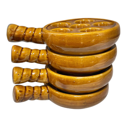 French brown ceramic escargots pots with multiple compartments on a white background