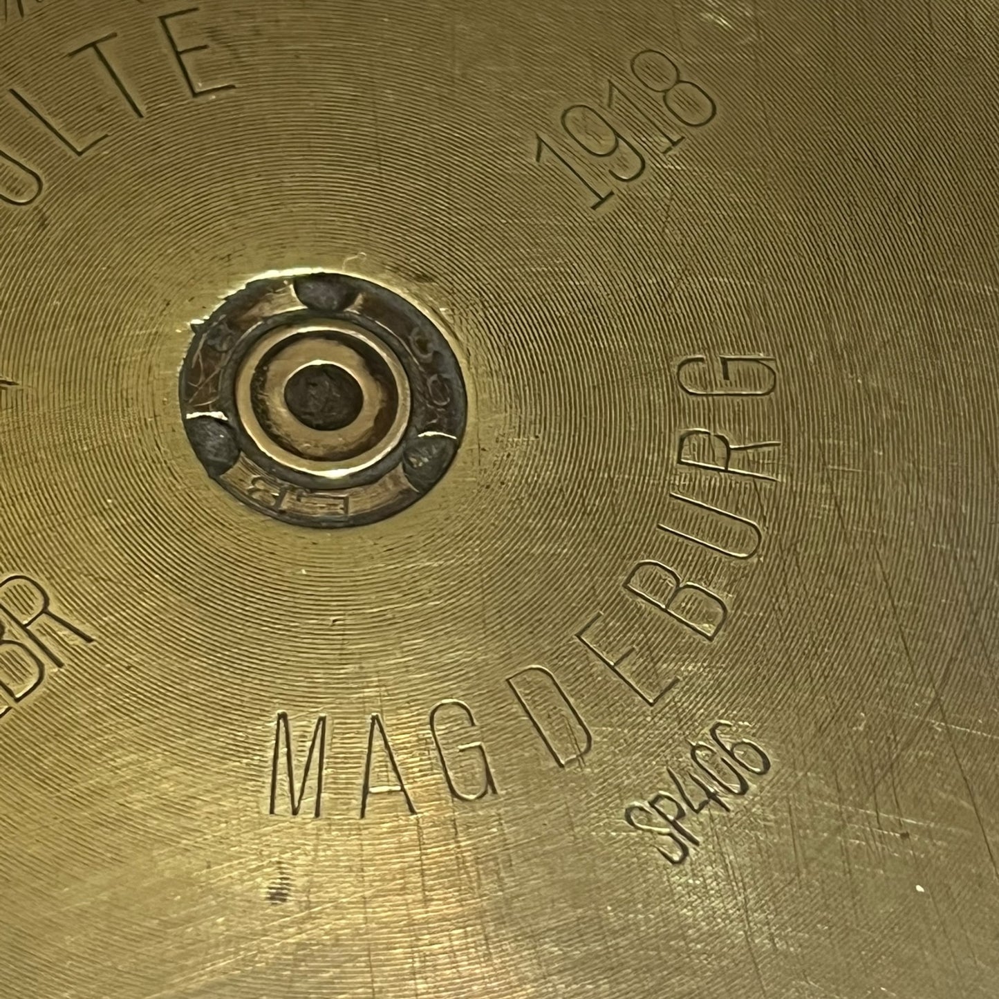 Close up of a brass WW1 German shell case on a white background