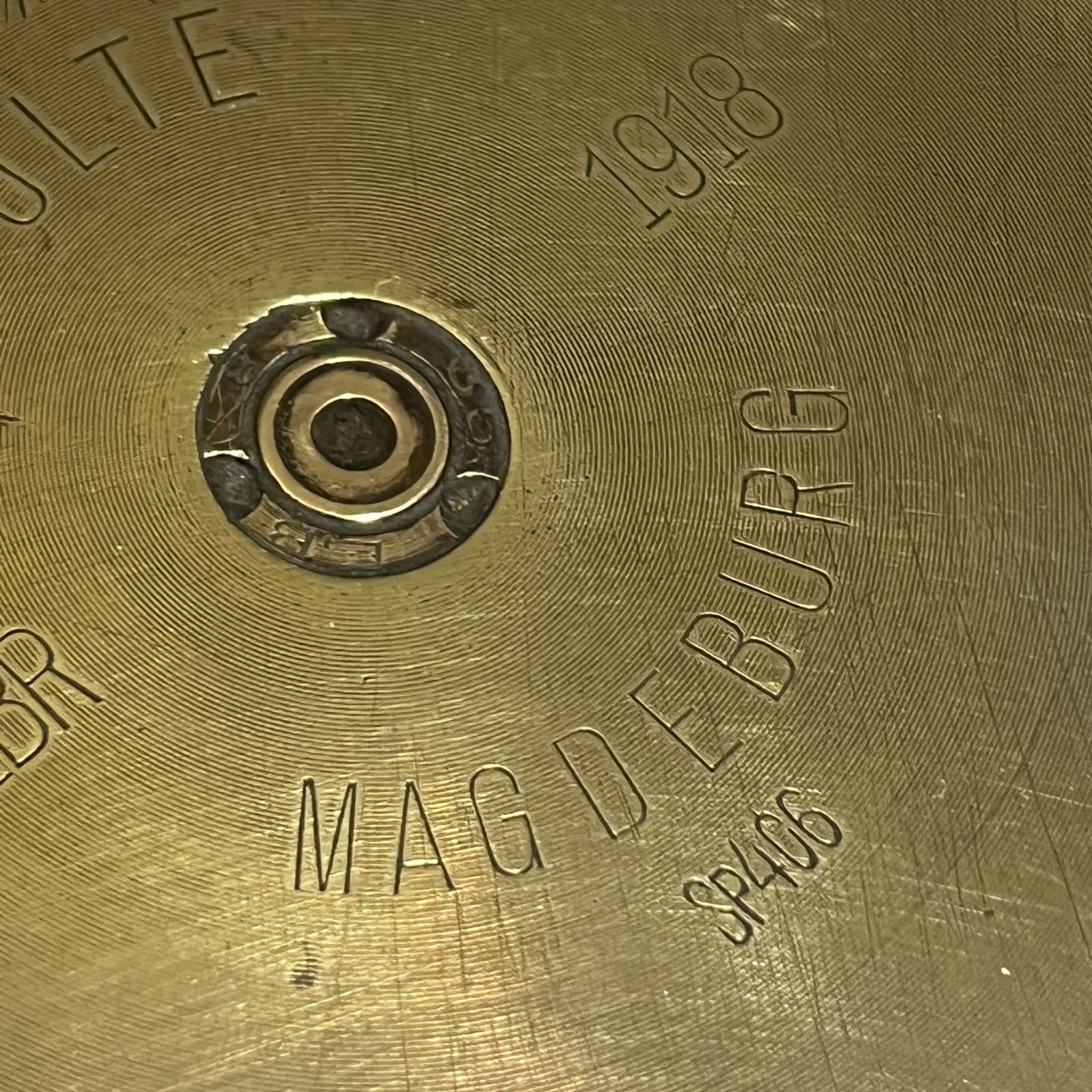 Close up of a brass WW1 German shell case on a white background
