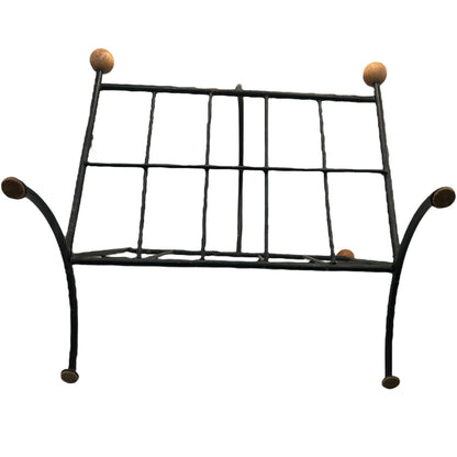 Close-up of a black metal stand on a white background