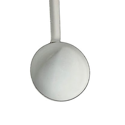 close up of a vintage kitchen utensil on a white background