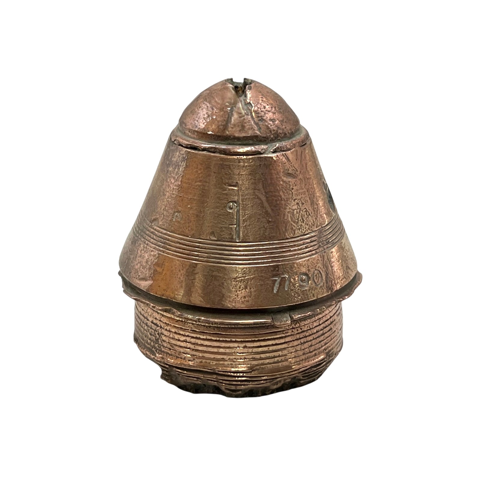 WW1 brass fuse paperweight on a white background