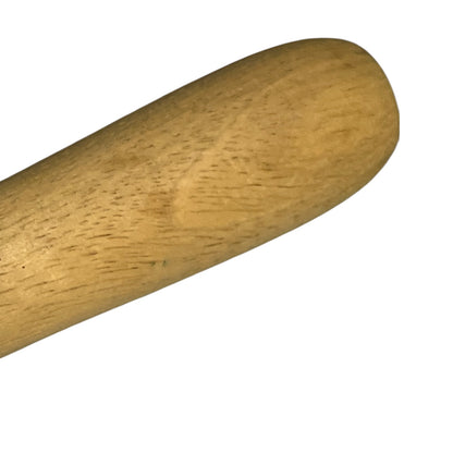 A close-up of a light brown wooden handle or rod tip against a plain white background.